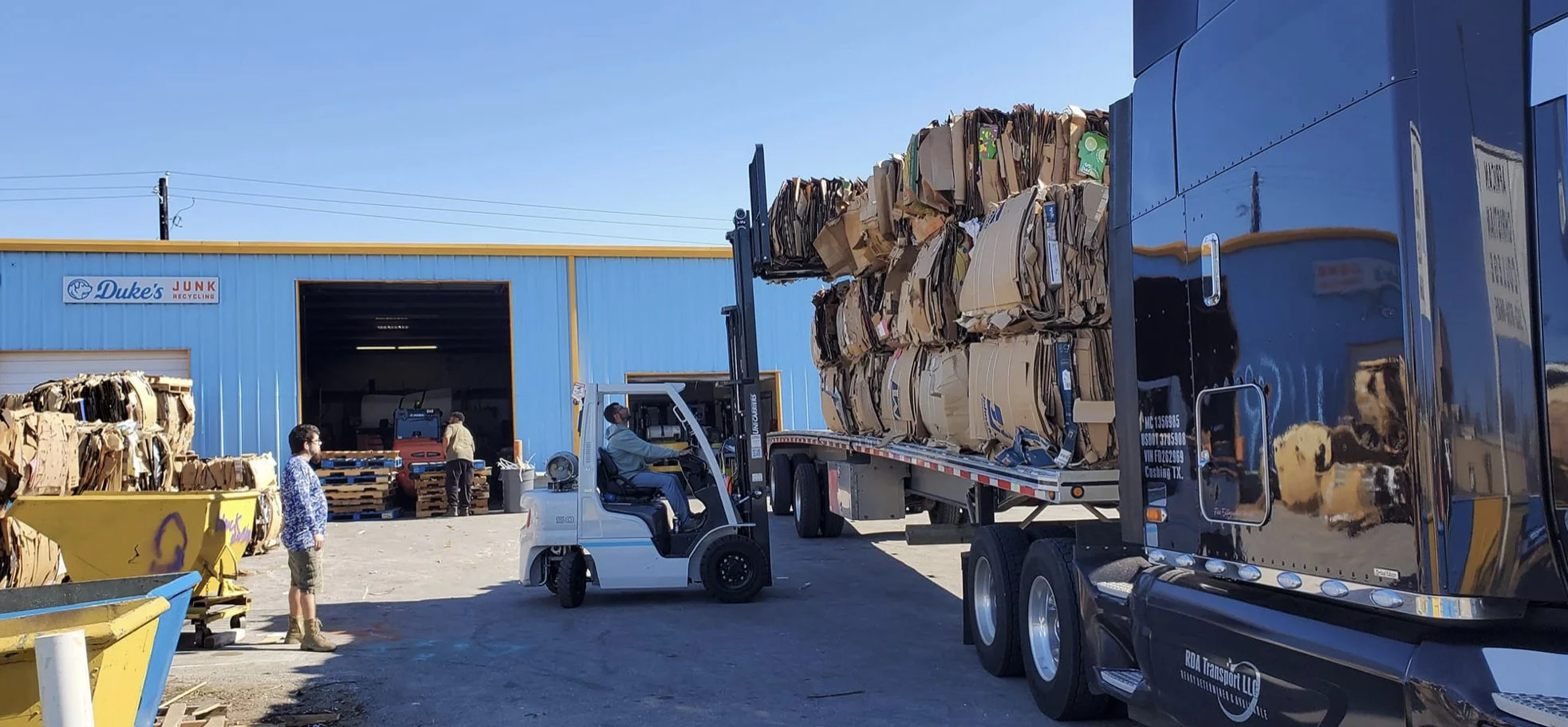 Garage cleanout in Austin, TX — boxes and clutter loaded on Duke's trailer